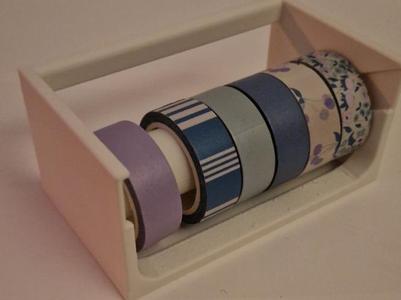Tape holder with serrated edge