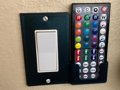 Light switch cover remote holder