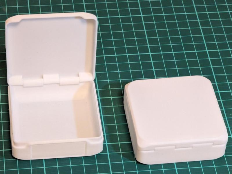 Small storage box with hinge