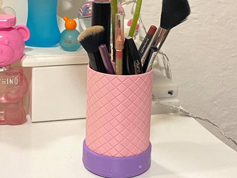 Pen/cosmetic holder with space for flowers and water