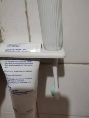 Toothbrush and Toothpaste Storage and Drying Rack