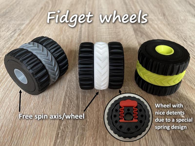Fidget wheels with detents and free spin