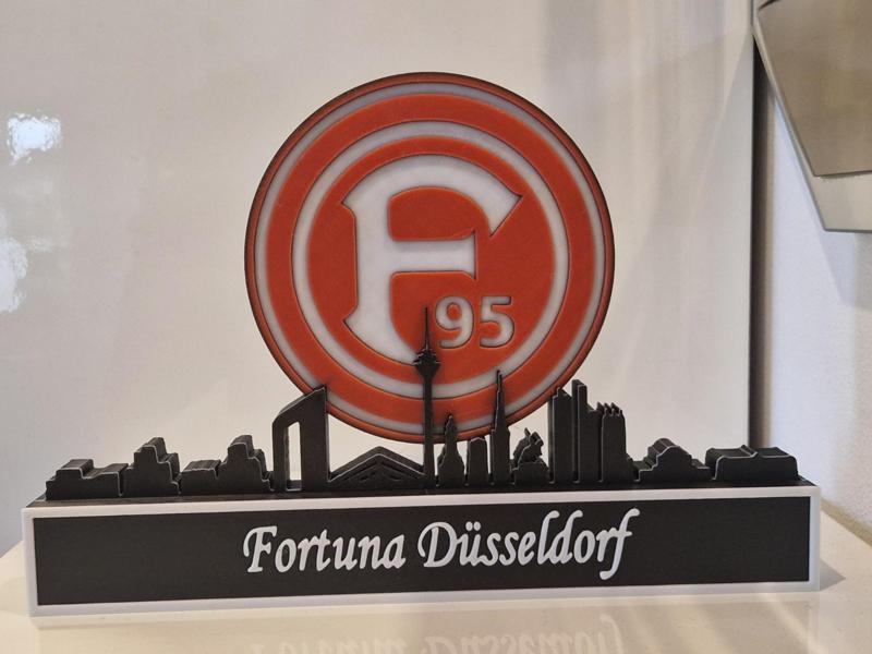 Fortuna Düsseldorf against a Düsseldorf skyline