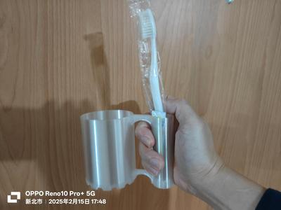 Mouthwash cup with toothbrush holder