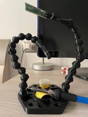 Soldering station with flexible brackets