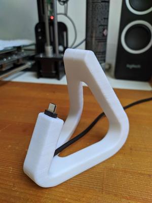 Curved phone stand with cable