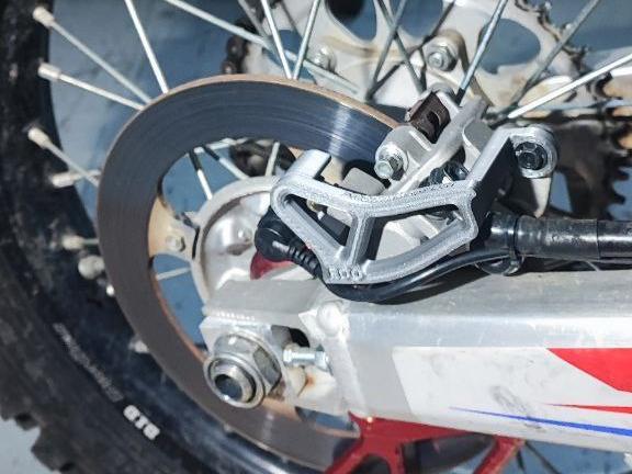 Honda CRF rear caliper guard