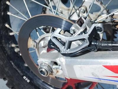 Honda CRF rear caliper guard