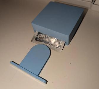 Discreet condom dispenser   
