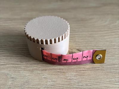 Packaging for a tailor's measuring tape