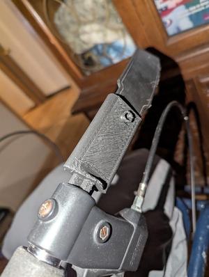 An adapter to replace the thing that holds the strap on my moms walker