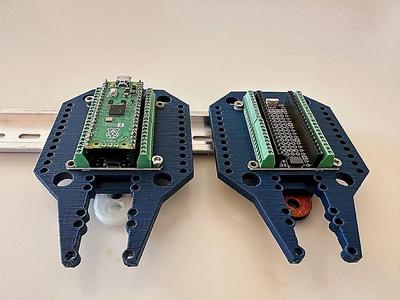 Din Rail mount for Adafruit PiCowbell Screw terminal board.