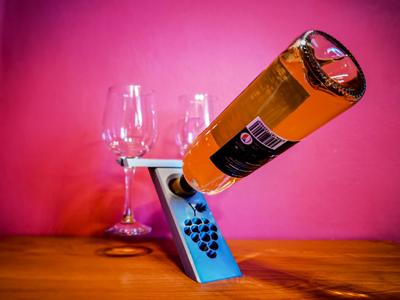 Bottle holder and wine glass.