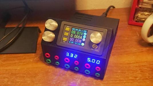All-in-one compact AC-DC power supply with three adjustable outputs