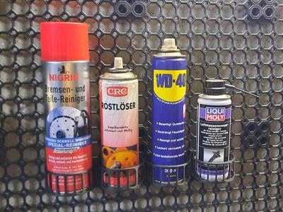 Spray can holder for multiboard
