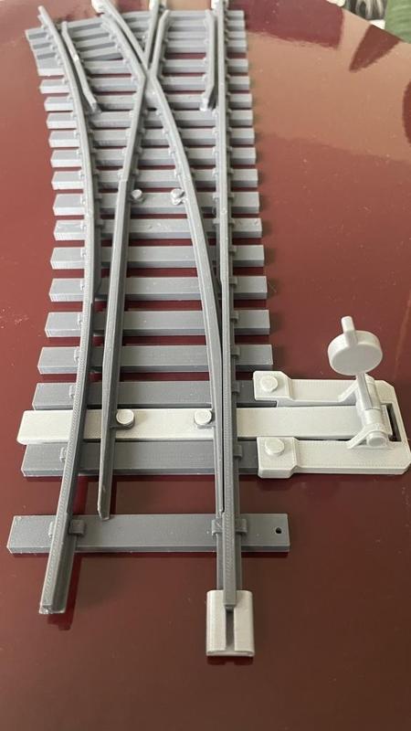 Adjustable mechanism for a 45mm rail switch