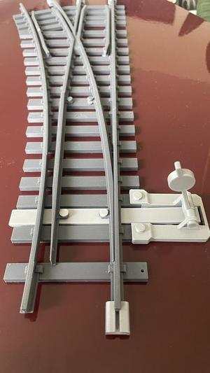 Adjustable mechanism for a 45mm rail switch