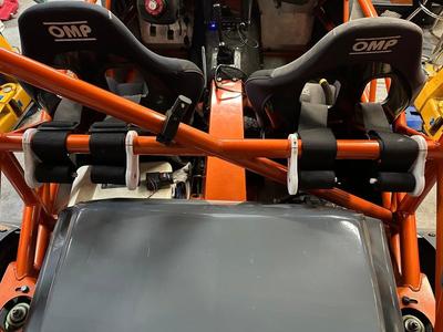 Racing harness slack holder