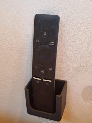 Remote control holder wall mounted