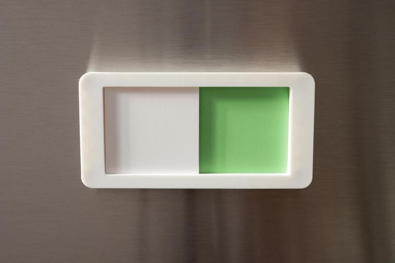 Dishwasher status slider, magnetic