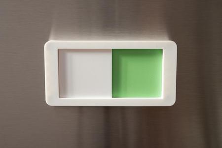 Dishwasher status slider, magnetic