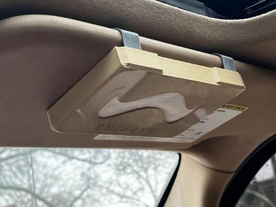 Visor clip napkin dispensor