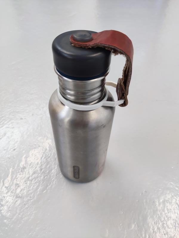Bottle cap/lid strap holder