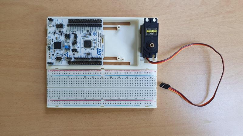 WIP: Adapter plate for STM Nucleo / Arduino boards to pair with breadboard and servos