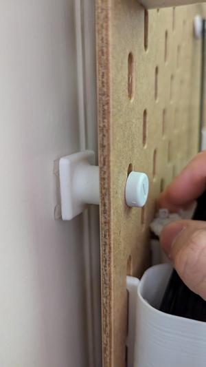 Skadis spacer for mounting tape mounting