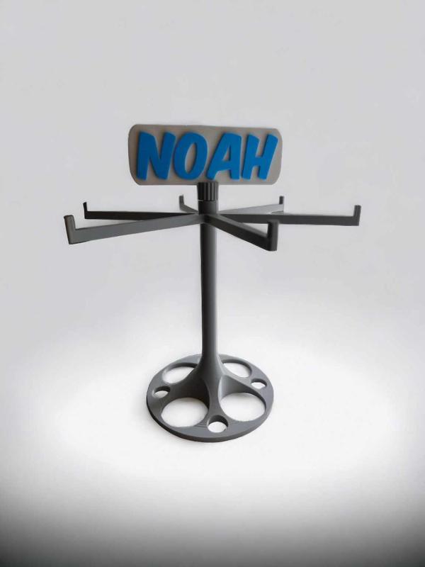 Rotating keychain display with tag on top