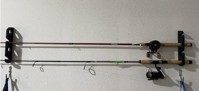 Wall-mounted fishing rod holder
