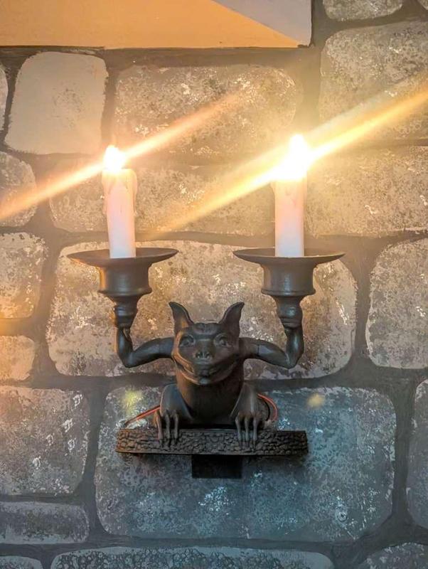 haunted mansion stretching room gargoyle sconce lamp 