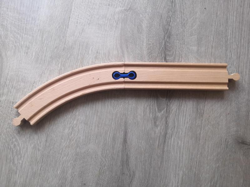 Flexible connector for wood train track