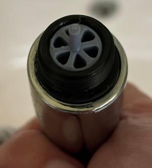 flow restrictor for wand showerhead