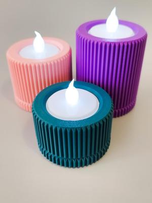 Candle holder with corduroy fabric texture.