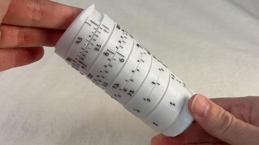 Helical slide rule / pencil holder