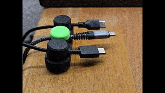USB cable organizer with magnetic holder
