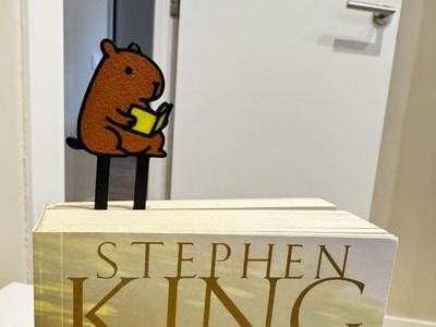 Capybara reading bookmark