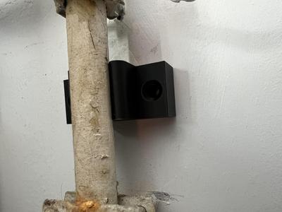 Hot water tank line wall spacer