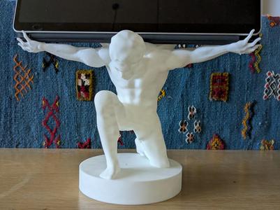 Outstretched arms holding modern world Surface Pro