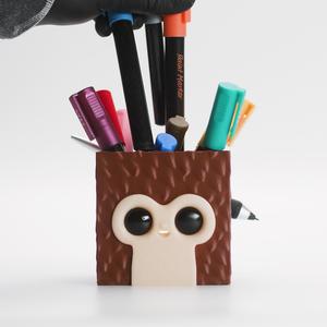 Default Cube meets Suzanne, a Pixel Monkey Storage Box with Pen Tail (Gridfinity Compatible!)