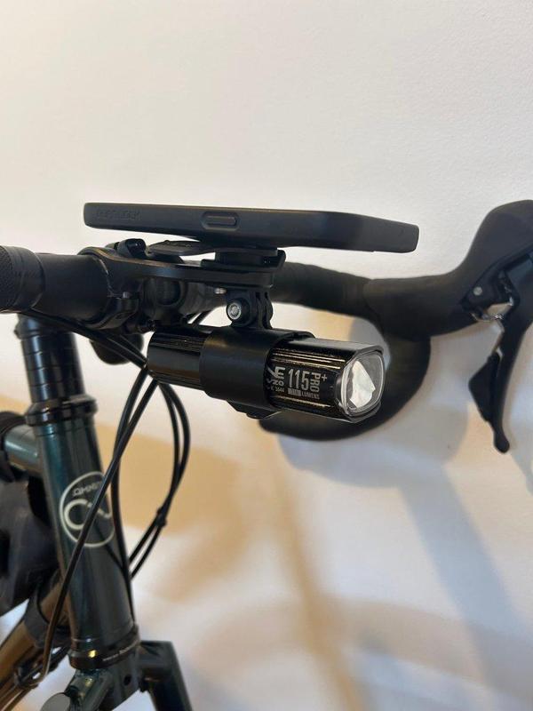 Flexible, adjustable flashlight holder for GoPro mounts