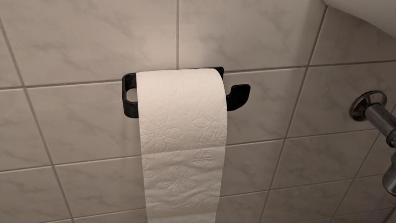 Minimalist toilet paper holder