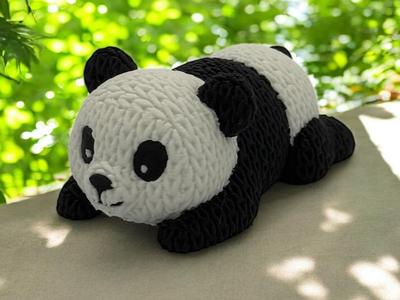 Cute Knitted lying panda bear
