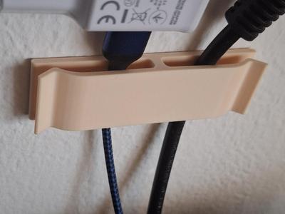 Wall-mounted cable holder – Simple & practical