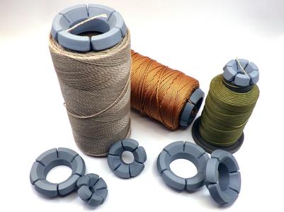 Spool cap that can secure the end of the thread. 