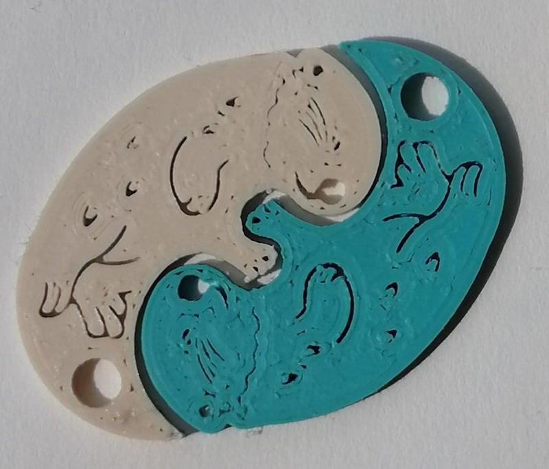 cuddling otters - keyring pendant