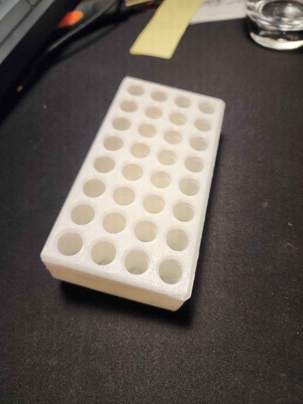 Wall mountable AAA battery holder