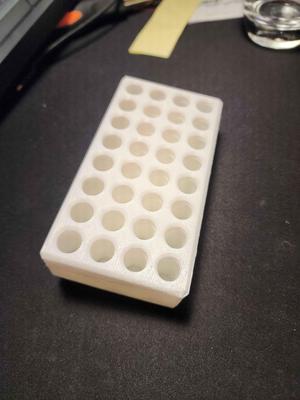 Wall mountable AAA battery holder