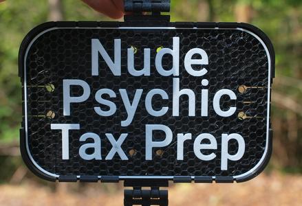Nude Pyschic Tax Prep sign